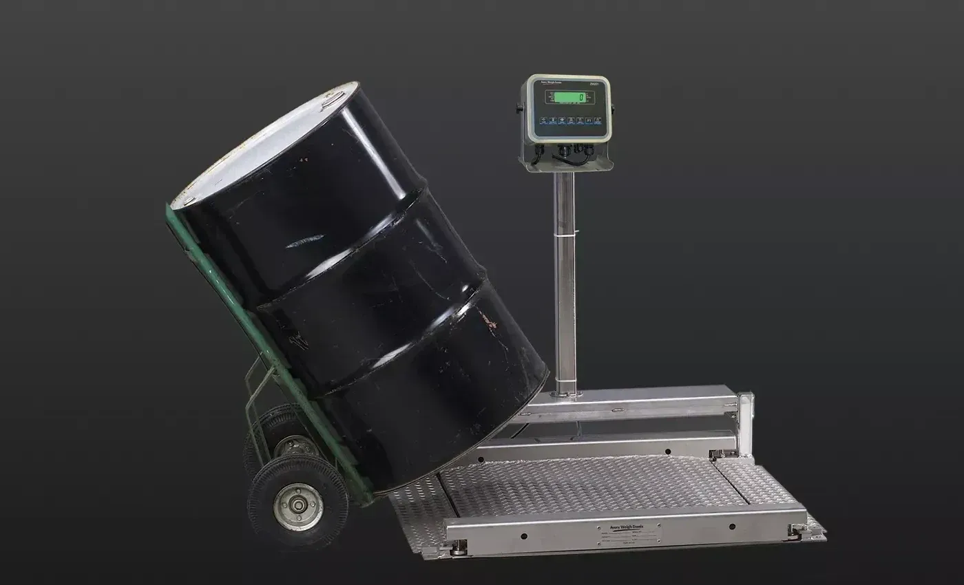 Drum being rolled onto a low-profile drum weigher