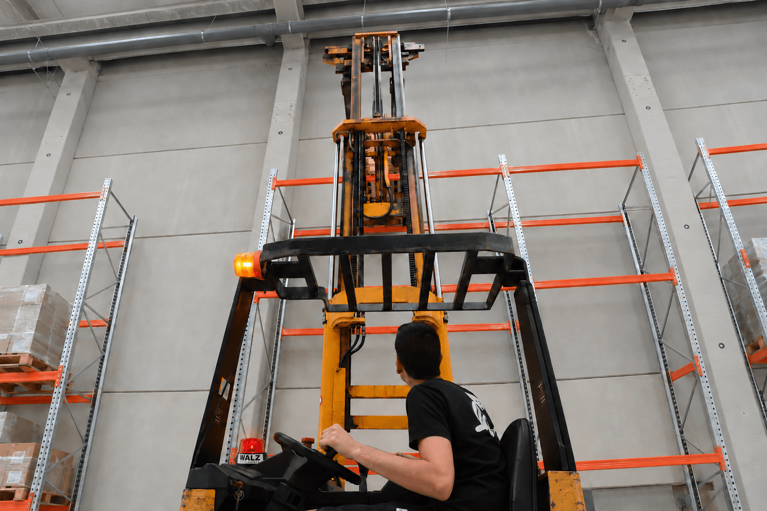 Forklift operator using the Walz HD-100 red height-alert beacon