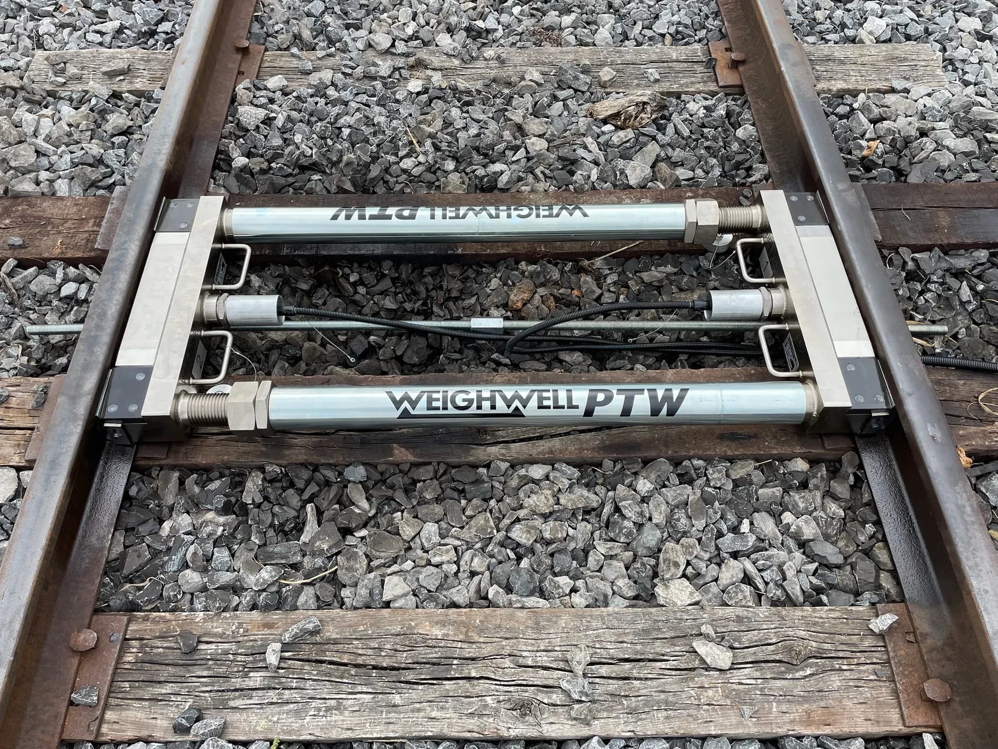 PTW1 rail scale installed across an active section of track.